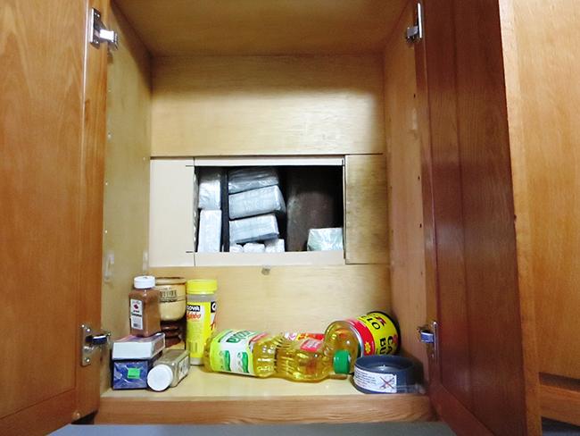 Money, heroin, and presses designed to compress narcotics into brick form.