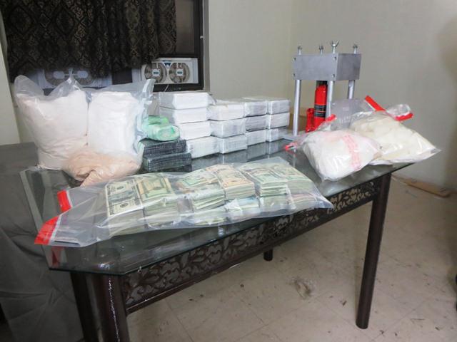 Trap accessed through a sliding panel on the back wall of the kitchen cabinet.