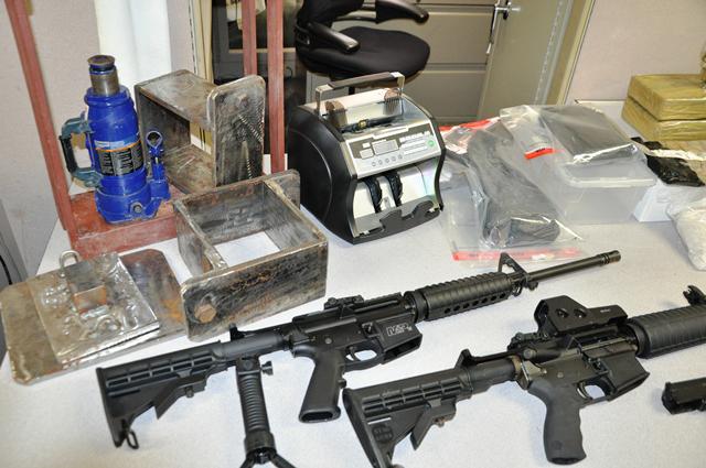 Three guns, including two assault rifles,