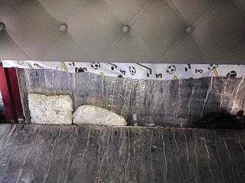 Concealed compartment used to hide 15 kilograms of heroin in side tractor trailer.
