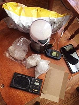 Heroin bags hidden in chip bags at the scene of a Heroin Mill.