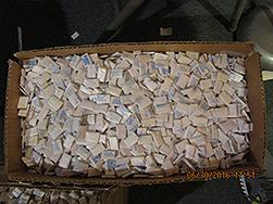 Heroin glassines stamped and ready for street distribution.