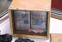 Child's chest opened to show two kilograms of cocaine concealed inside.