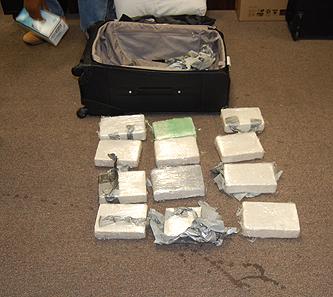 24 kilograms of cocaine seized by DEA and ICE at PHL concealed in two separate suitcases.