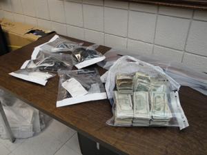 Weapons and money seized.