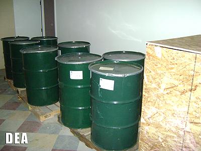 55 gallon drums filled with dirt and soil from excavation. 