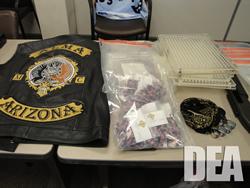 Alma Motorcycle Club Member's leather vest; multiple packages of steroid capsules; encapsulating machines; knuckle rings.