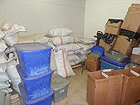 Photos of spice manufacturing at various stages.  Cement mixers, bulk damiana leaf in bags and bins.