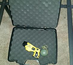 Taser and hand grenade retrieved from an apartment.