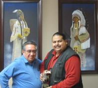 Yakama Nation Tribal Council Chairman Harry Smiskin and award recipient Captain James Shike III displaying the first DEA Tribal Narcotics Officer of the Year Award.