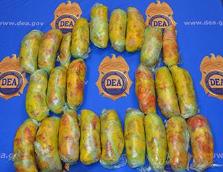 During the search of a vehicle, agents located an access panel in the rear cargo area which accessed the gas tank where they located 53 pounds of heroin. 