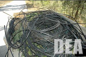 Miles of irrigation tubing of several dimensions were removed from the Rabbit Creek grow, along with eradicated marijuana plants.  This photo shows one load hauled out with long-lines by helicopter.