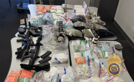 L.A. Seizure with drugs, cash, and guns in the image