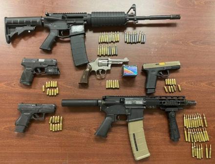 ssault rifles, ghost guns, ammunition, and a high-capacity magazine recovered by the investigation